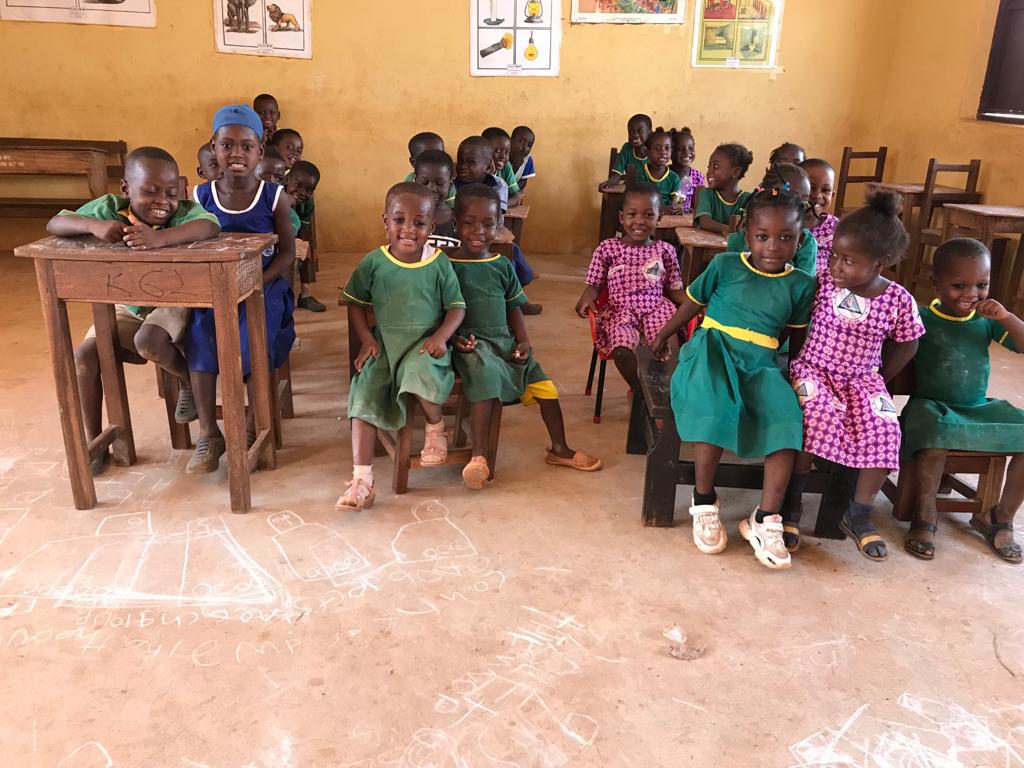 Image of Children in classroom holding their books